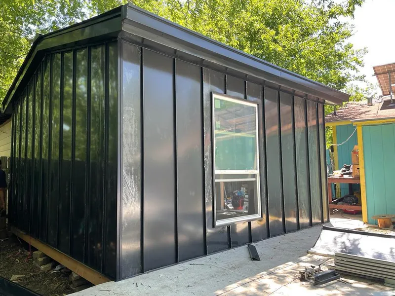 Black standing seam metal wall panels for Roof Inspection in Ozark