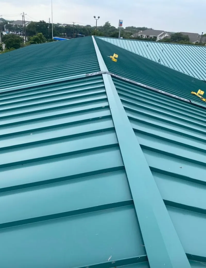 Green commercial metal roof ridge and valley for Metal Roof Repair in Ozark