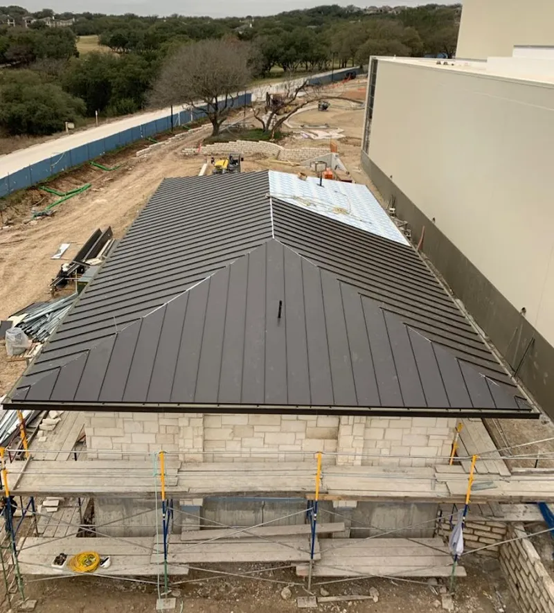 Metal roof new construction with scaffolding in Ozark